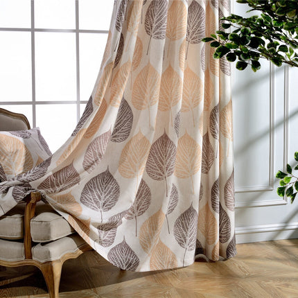 Gardin med stort lövmönster i jordnära färger