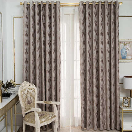 Taupe mörkläggningsgardin med abstrakt mönster