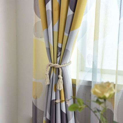 Mörkläggningsgardin med abstrakt mönster i gult