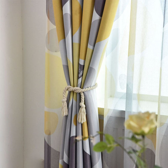 Mörkläggningsgardin med abstrakt mönster i gult