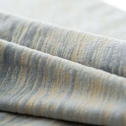 Texturerad mörkläggningsgardin med vågmotiv