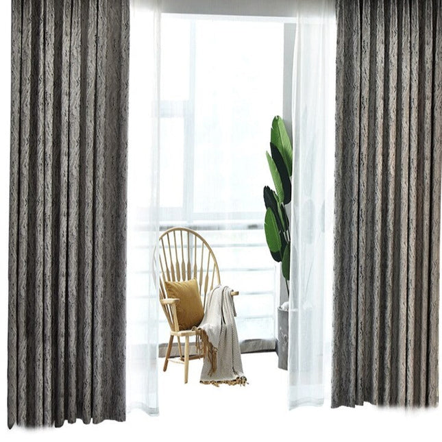 Grå mörkläggningsgardin med modernt mönster