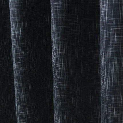 Grön mörkläggningsgardin med vävd struktur