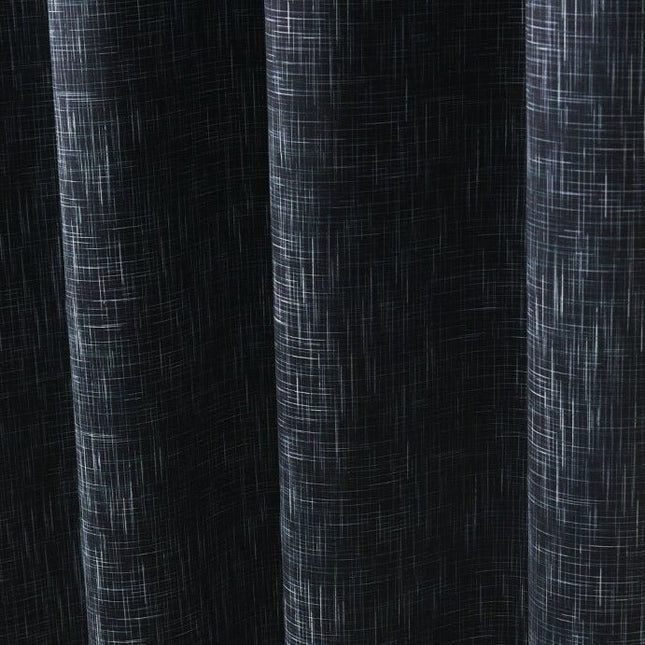 Grön mörkläggningsgardin med vävd struktur