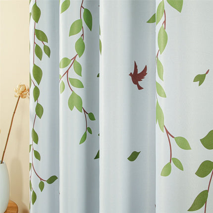 Gardin med mönster av blad och fåglar