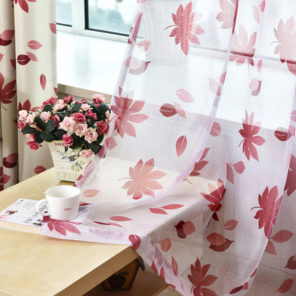 Tunn gardin med motiv av lönnlöv