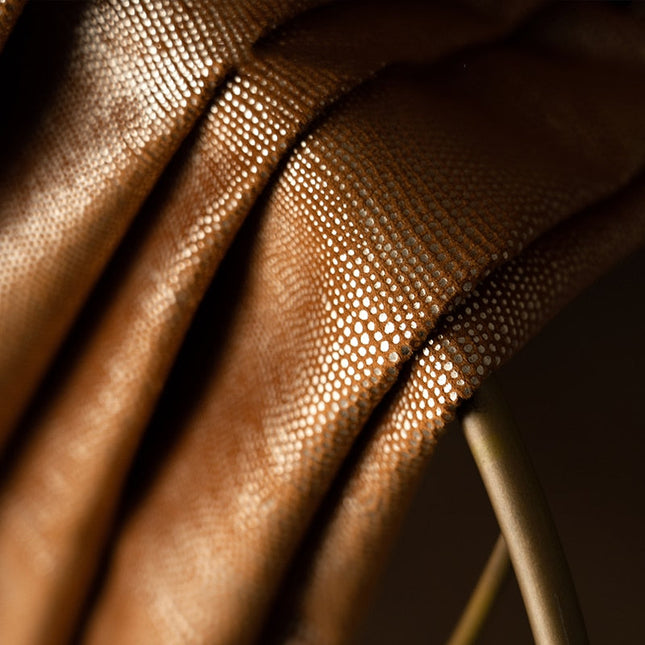 Orange mörkläggningsgardin med struktur