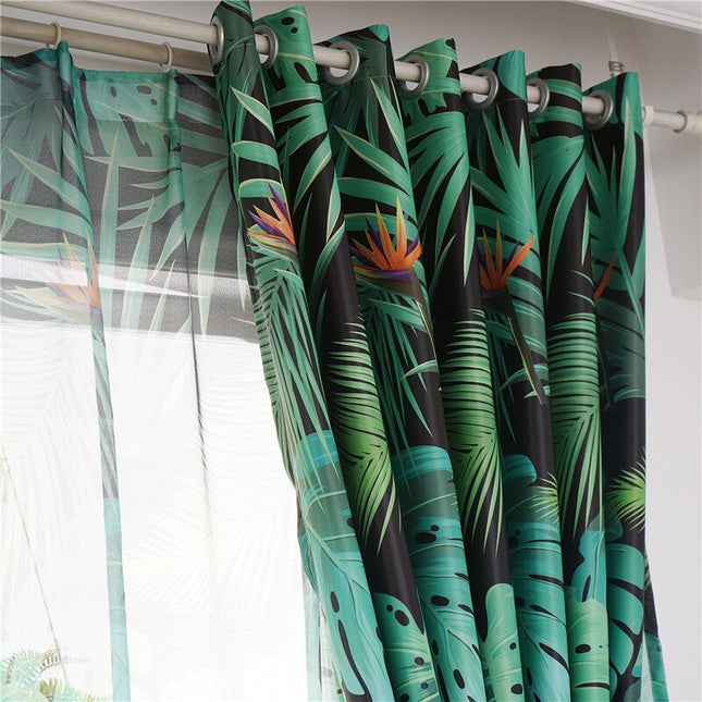 Dubbel gardin med tropiskt mönster