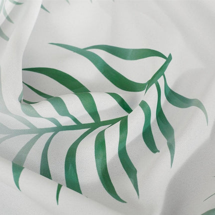 Gardin med tropiskt palmbladsmönster