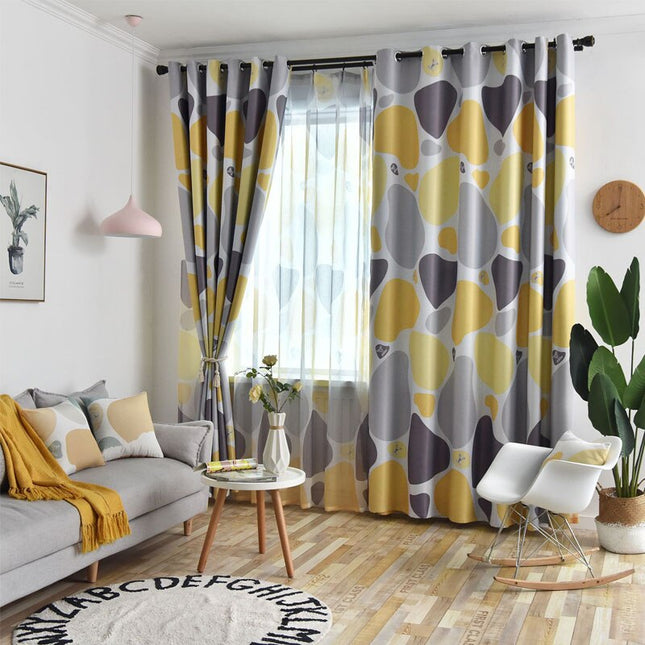Mörkläggningsgardin med abstrakt mönster i gult