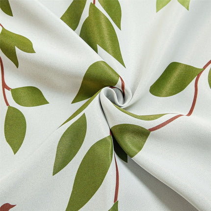 Gardin med mönster av blad och fåglar