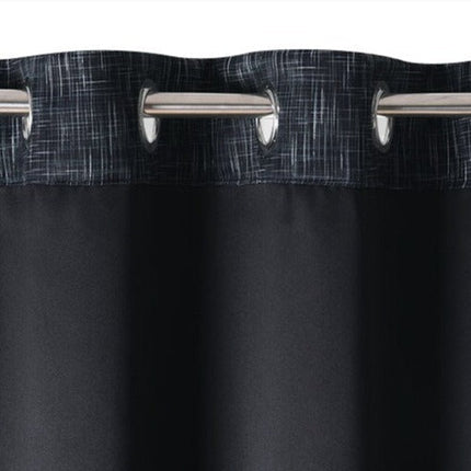 Grön mörkläggningsgardin med vävd struktur