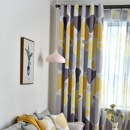 Mörkläggningsgardin med abstrakt mönster i gult