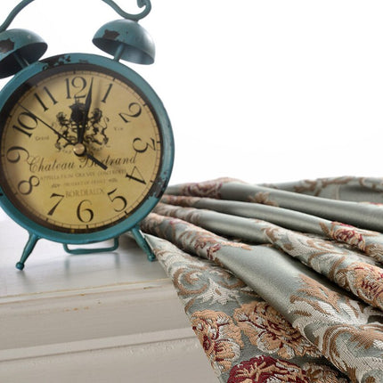 Mörkläggningsgardin i jacquard med blommönster