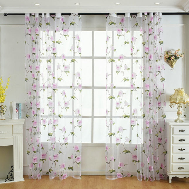 Tunn gardin med rosa blommönster