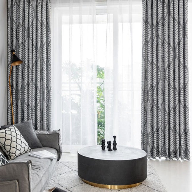 Mörkläggningsgardin med modernt lövmotiv