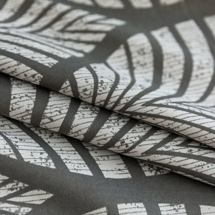 Mörkläggningsgardin med modernt lövmotiv