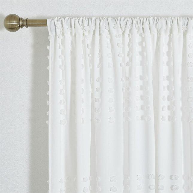 Vit gardin med vävd pom-pom-textur
