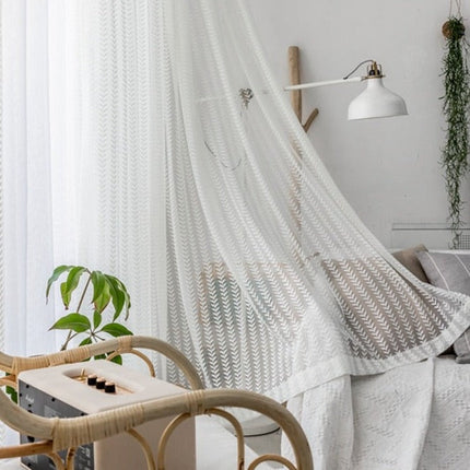 Ljusfiltrerande gardin med fiskbensmönster