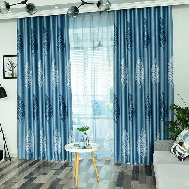 Modern gardin med stilrent fjädermotiv