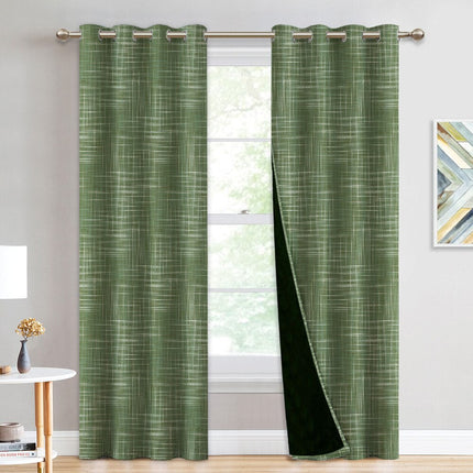 Grön mörkläggningsgardin med vävd struktur