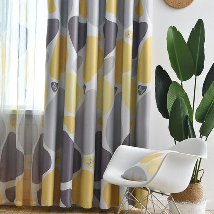 Mörkläggningsgardin med abstrakt mönster i gult