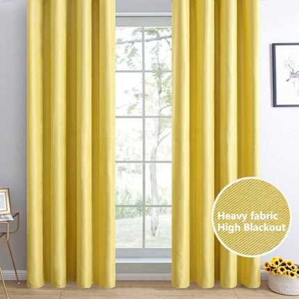 Ljusgul mörkläggningsgardin med öglor.