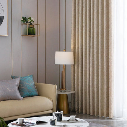 Beige mörkläggningsgardin med vågigt mönster