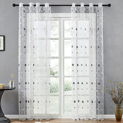 Tunn gardin med elegant brodyr