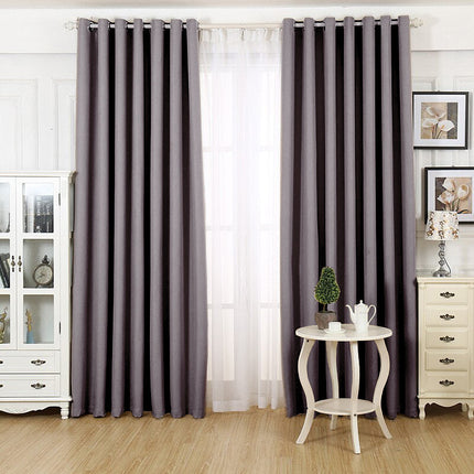 Grå mörkläggningsgardin med öljetter